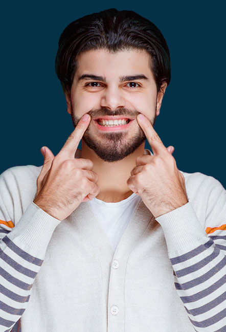 Proud male in his 30s showing off healthy teeth with a smile